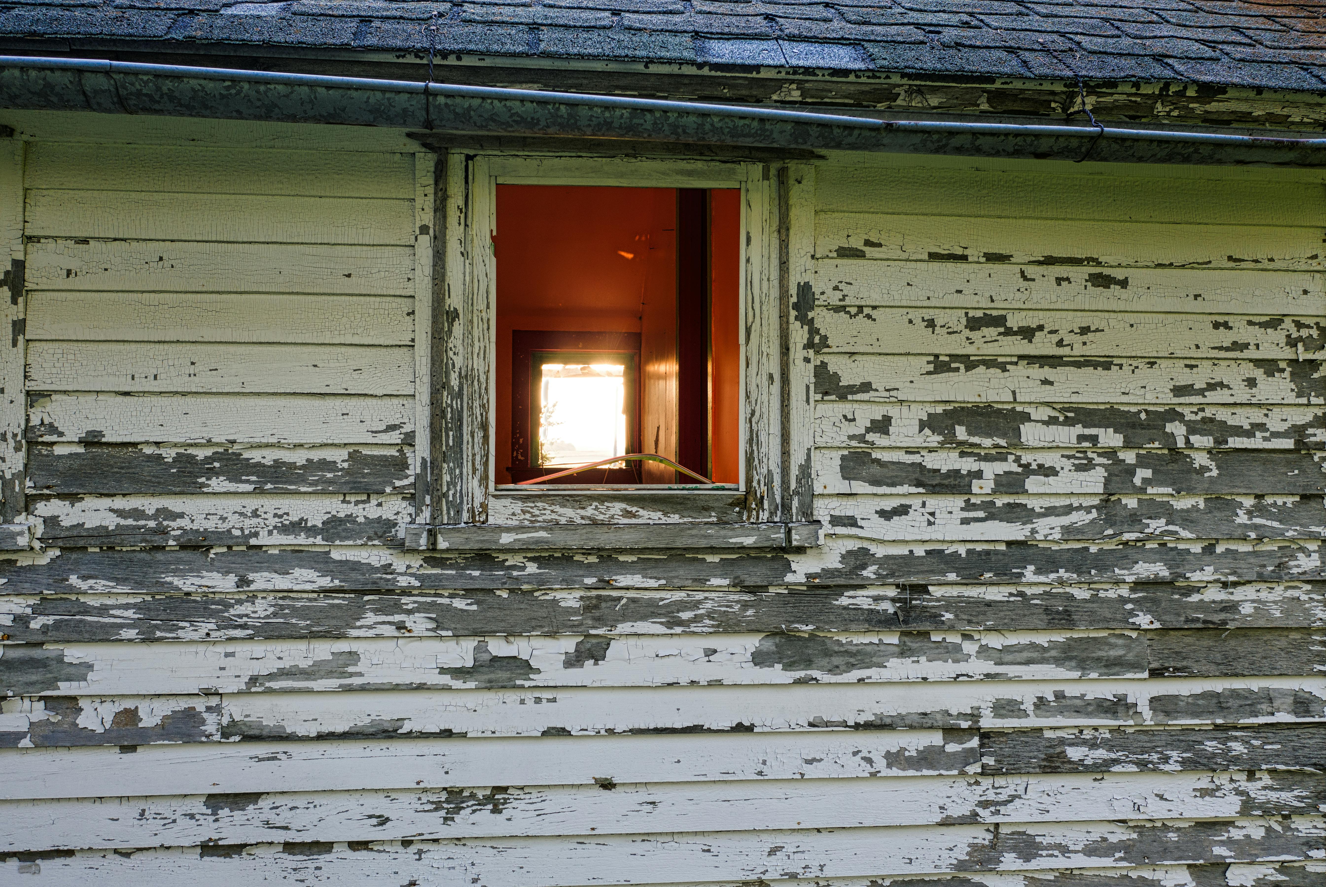 Siding replacement project showing new James Hardie fiber cement siding installation